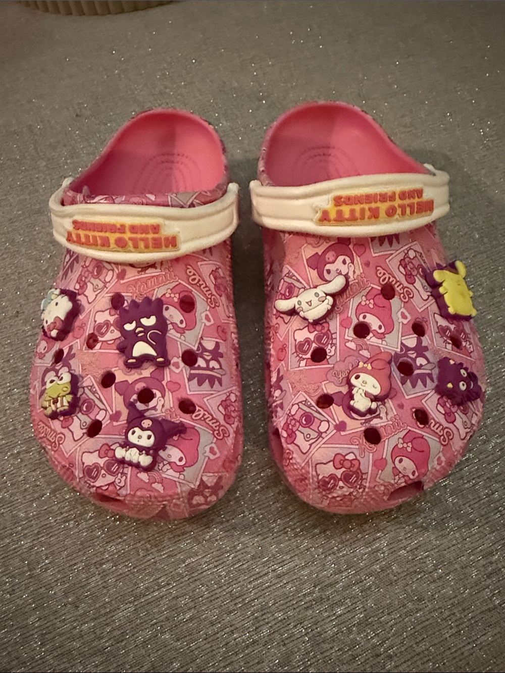 Hello kitty crocs.  Size 9